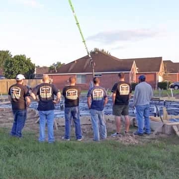 Professional Inspector students viewing a foundation pour